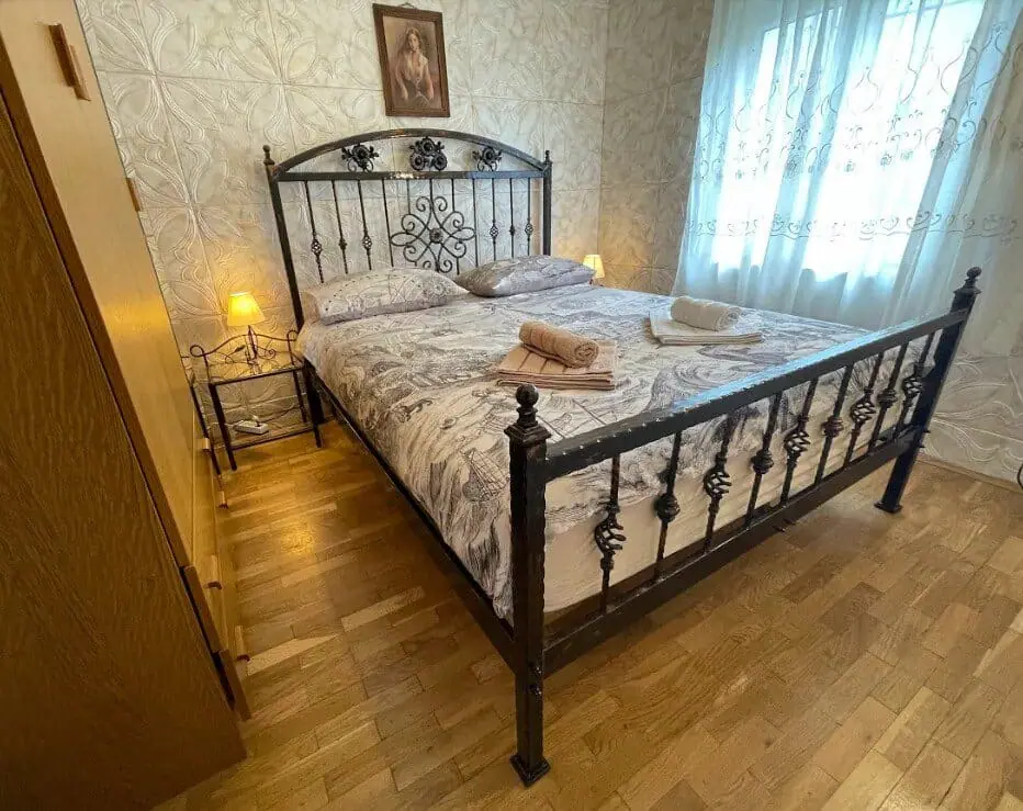 Bedroom with wrought-iron bed