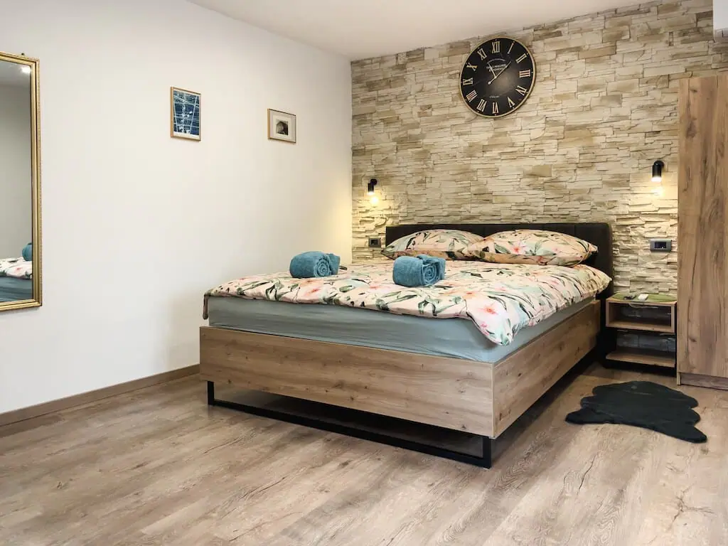 Bed with stone feature wall