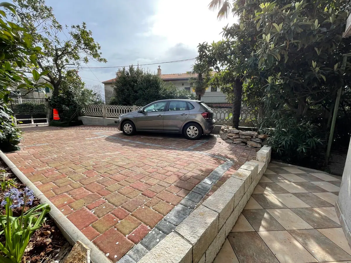 Shared private parking area in front of the house